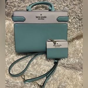 Kate spade purse with purse strap.